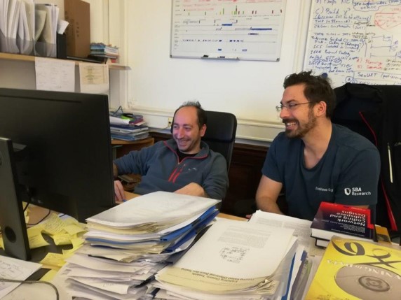 Dimitris Simos at work with a colleague