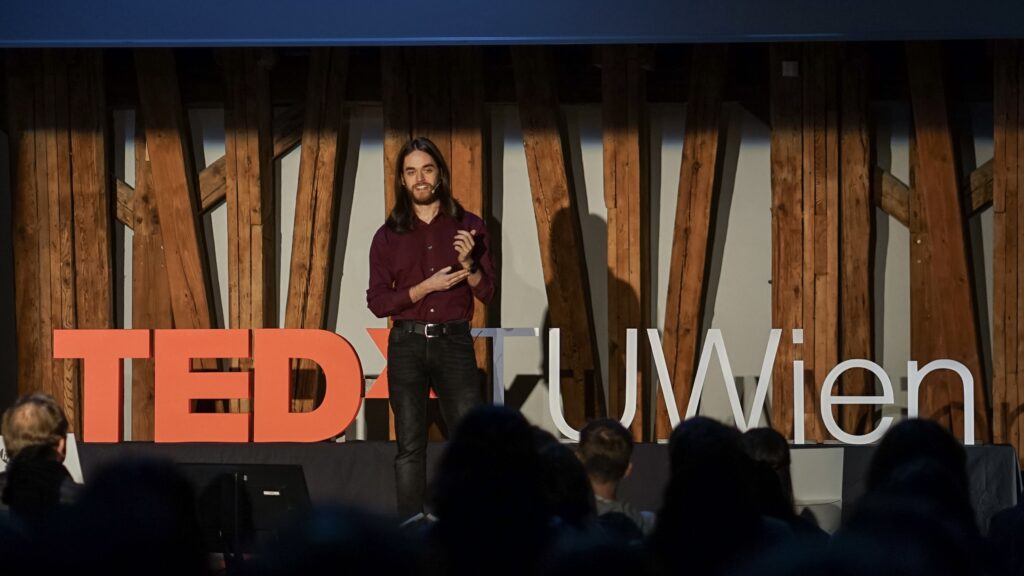 Michael Koppmann on the TEDx stage. 