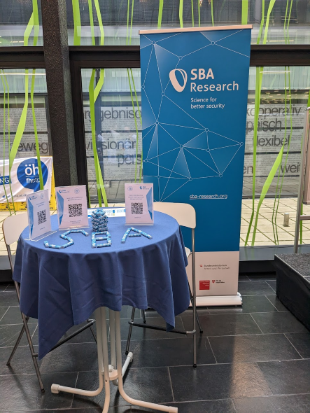 Trade fair stand with high table and roll up with SBA logo 