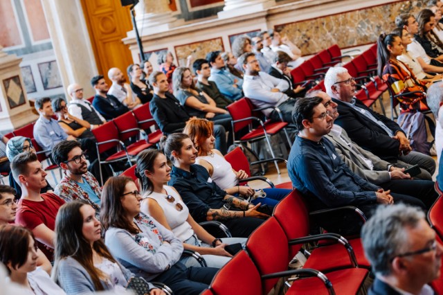 audience at "Großer Festsaal" of Uni Wien