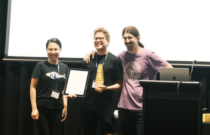 Gabriel Gegenhuber with best paper award from raid 2025 on stage