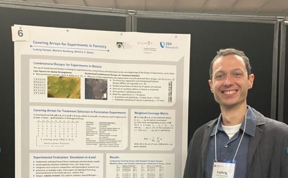 Ludwig presenting his poster at DAE 2026